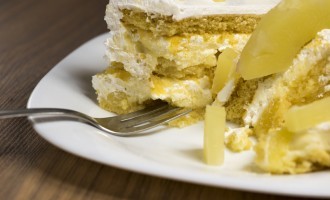 Pineapple Poke Cake With Pineapple Sauce & Cream Cheese Frosting