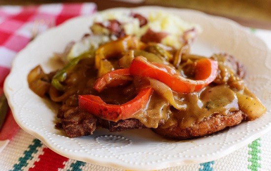 The Best Way To Serve Pork Chops Is Smothered & Covered With A