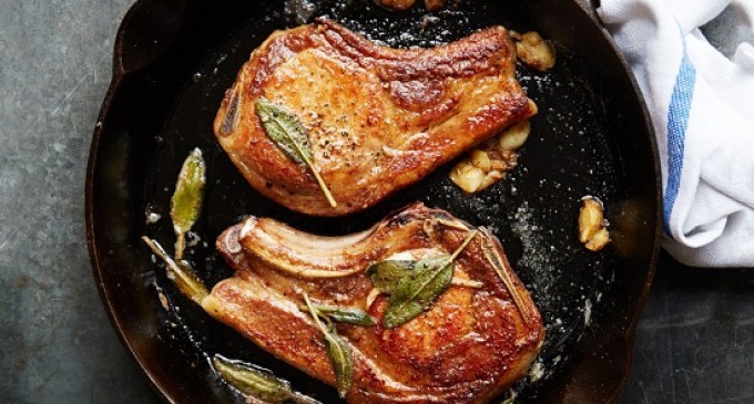 These Tender Sage, Butter & Garlic Pork Chops Will Be The New Favorite Thing To Make In A Skillet