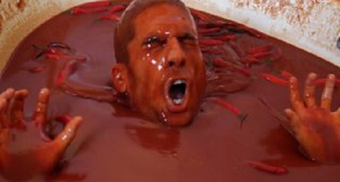 (Video) A Thrill-Seeking Idiot Jumps Into A Bathtub Full Of Extra Spicy Hot Sauce & Eats Chili Peppers