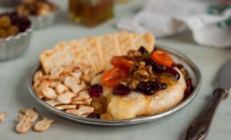This Brie Cheese Topped With The Most Delicious Cranberry Walnut Fruit Compote Makes A Wonderful Appetizer!